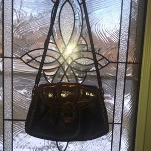 Brighton black leather handbag with brown tortoise accents, fancy rope handle.